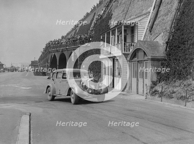 Wolseley saloon of HB Brownright and HE Symons on Madeira Drive, Brighton, RAC Rally, 1939. Artist: Bill Brunell.