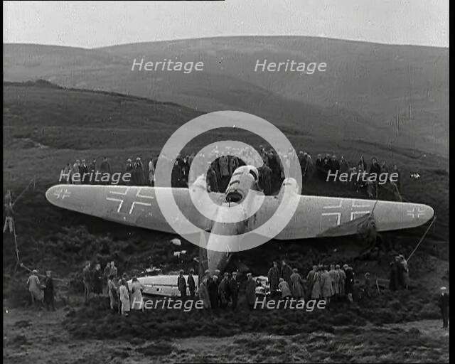 A Downed German Airforce Bomber Lying in a Scottish Field With a Rope Fence Around it and..., 1939. Creator: British Pathe Ltd.