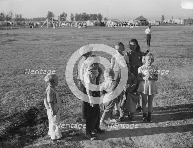 Children of migratory pea pickers in Brawley camp, California, 1939. Creator: Dorothea Lange.