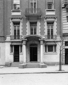 Four-story townhouse, entrance with pilasters and curved pediment, possibly New York, c1900-1905. Creator: William H. Jackson.