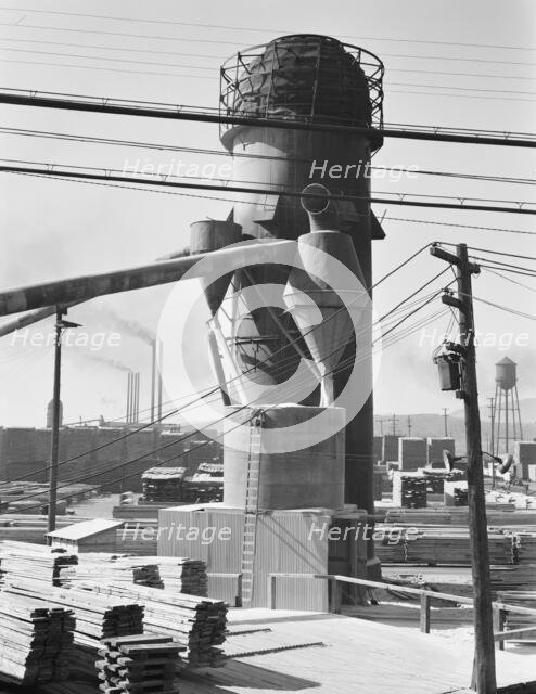 Possibly: Lumber burner and stacks of the Big Lakes Lumber Company..., Klamath Falls, Oregon, 1939. Creator: Dorothea Lange.