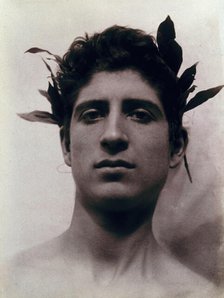 Head of a Sicilian boy posing, crowned with laurel leaves, March 1902. Creator: Count Wilhelm von Gloeden.