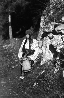 Young woman holding a jug, Bistrita Valley, Moldavia, north-east Romania, c1920-c1945. Artist: Adolph Chevalier