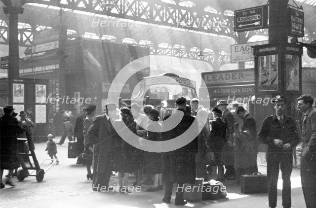 Locomotive spotters at Victoria Station, London, 1950. Artist: Henry Grant