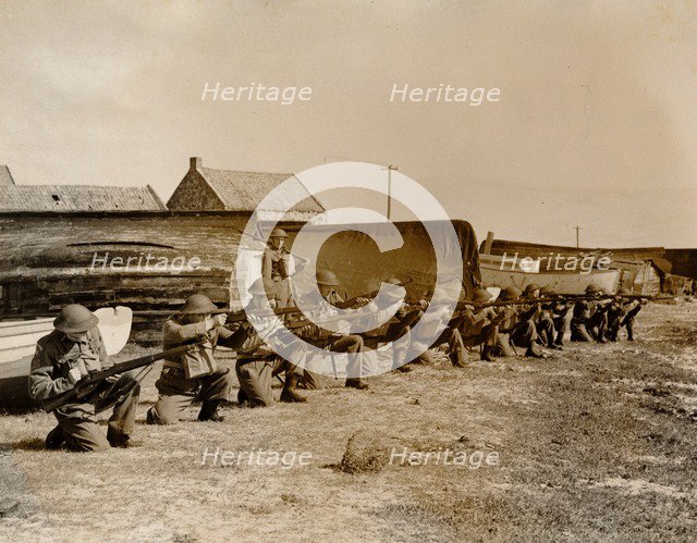 Holy Island fishermen Home Guards rifle practice, Lindisfarne, Northumberland, World War II, 1942. Artist: Unknown