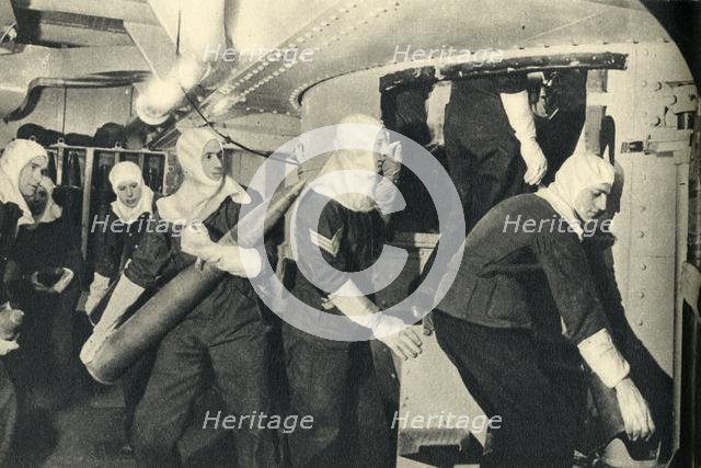 Royal Marines handling ammunition on board HMS 'Illustrious', World War II, c1939-c1943 (1944). Creator: Unknown.