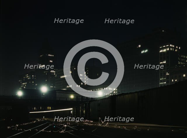 Night view of part of the South Water street freight terminal...Illinois Central R.R., Chicago, 1943 Creator: Jack Delano.
