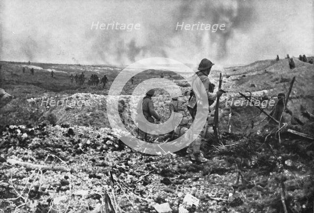 In Champagne: a surprise attack; While part of the group held back to clear the ground..., 1917. Creator: Unknown.