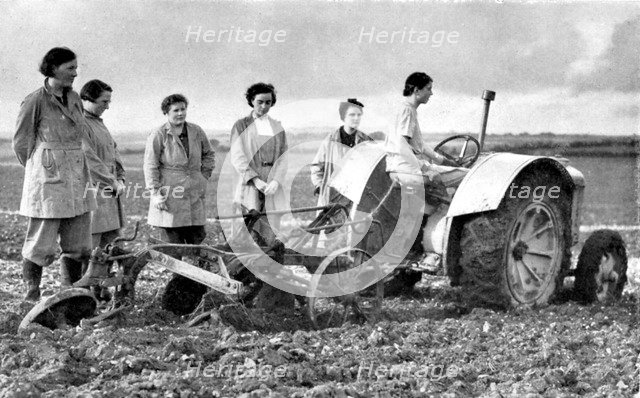British girls of the Women's Land Army learning to plough with a tractor, World War II, 1939-1945. Artist: Unknown
