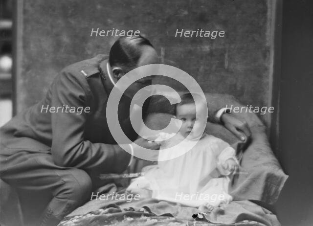Lieutenant H.B. Stimson and baby, portrait photograph, 1918 May 8. Creator: Arnold Genthe.