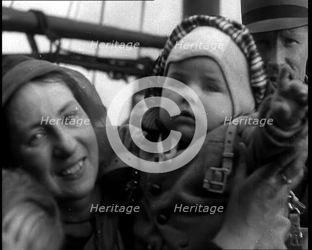 Dutch Refugees Fleeing Aboard Ships in the Netherlands. A Woman Holding Her Baby Is..., 1940. Creator: British Pathe Ltd.