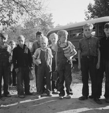 The children from Dead Ox Flat get off bus at school yard, Ontario, Malheur County, Oregon, 1939. Creator: Dorothea Lange.