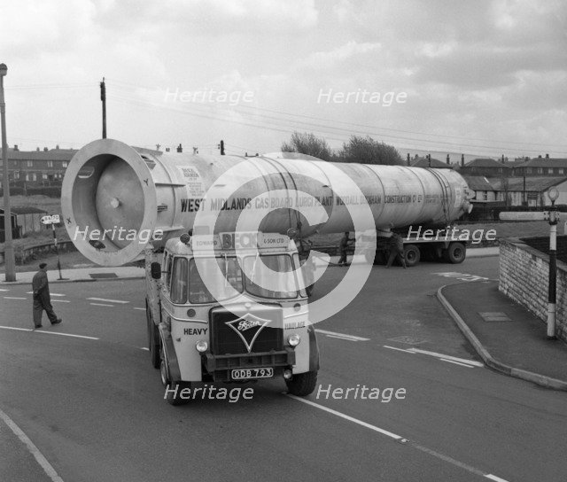 An absorption tower being transported by road, Dukenfield, Manchester, 1962. Artist: Michael Walters