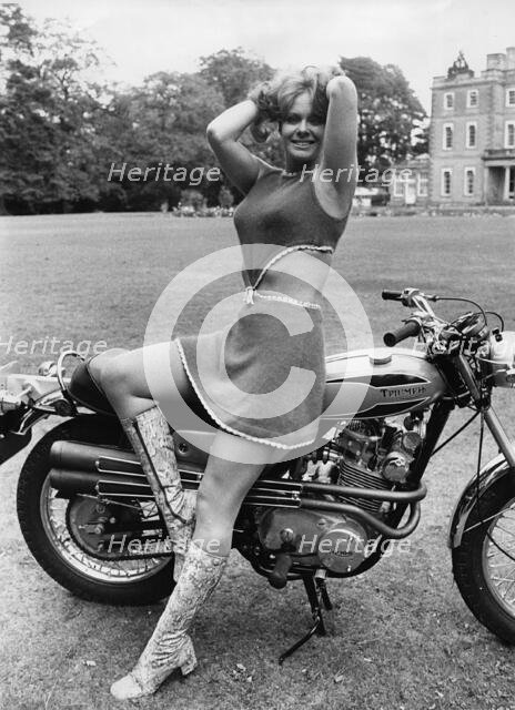 Monty Python actress Carol Cleveland on Triumph Bandit motorcycle, 1971. Creator: Unknown.