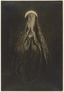 Portrait of a Woman Wearing a Long, Veiled Hat, about 1922. Creator: Francis Joseph Bruguiere.