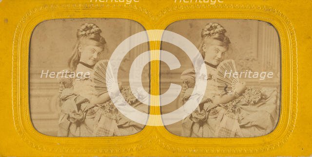 Woman seated on a divan holding a hand fan, 1860s. Creator: E Lamy.