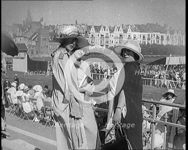Three Female Civilians Wearing Smart Summer Outfits Posing for the Camera in a Horse Race, 1920. Creator: British Pathe Ltd.