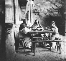 Fangguangyan monastery, Fujian province, China: three monks at the meal table, 1870-18711. Creator: John Thomson.