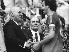Michel Platini receiving the 1984 European Championship trophy, Parc des Princes, Paris. Artist: Unknown