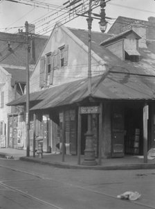 Corner store in the French Quarter, New Orleans, between 1920 and 1926. Creator: Arnold Genthe.
