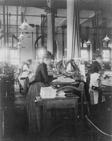 Women operating machinery at the Bureau of Printing and Engraving, Washington, D.C., 1889 or 1890. Creator: Frances Benjamin Johnston.