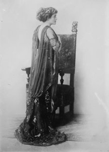 Katherine Kaelred standing before chair, Moffett Studio in Chicago, 1910. Creator: Bain News Service.