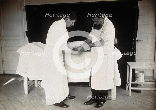 F  Lejars demonstrating operation techniques, c1900s. Creator: E Guillot.