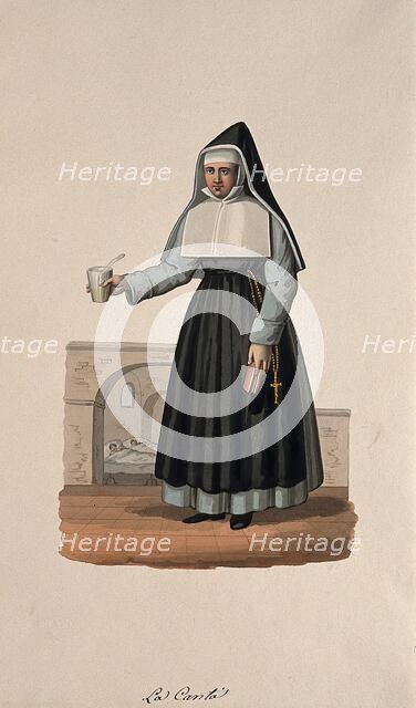 A nun in her habit carrying medicine and her Bible, with her hospital behind her. Creator: Unknown.