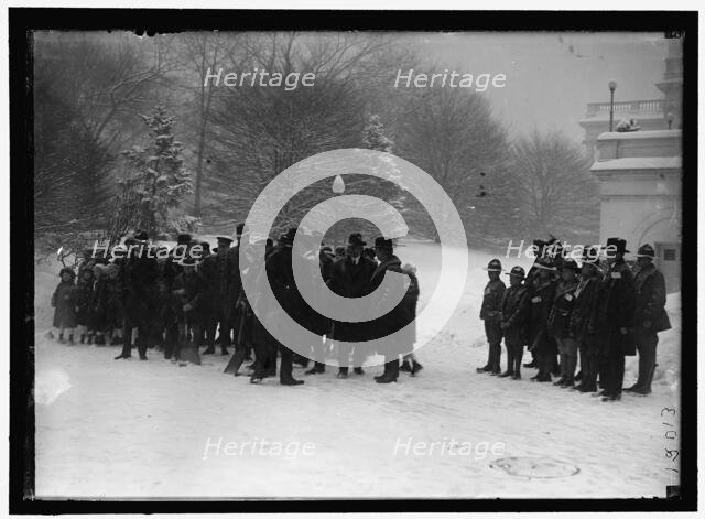 Group outside White House in snow, between 1913 and 1918. Creator: Harris & Ewing.
