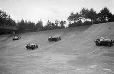 Bugatti Type 43, Sunbeam and Invicta racing on the Members Banking at Brooklands. Artist: Bill Brunell.