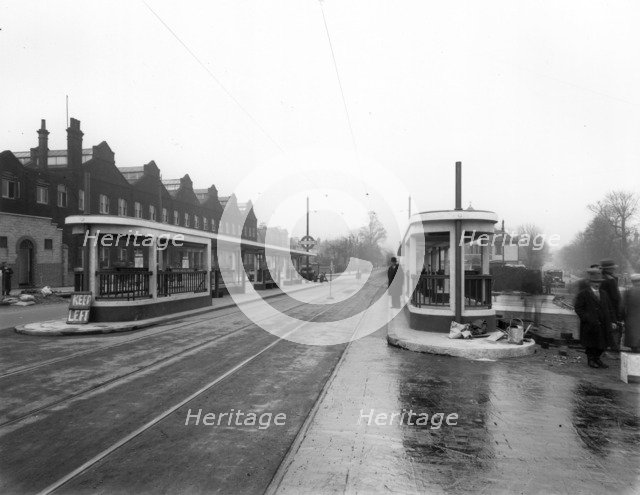 Passenger shelters at Manor House Underground Station, Stoke Newington, London, c1932.  Artist: Herbert Felton