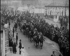 Crowds Stand by and Cheer as King George V and Queen Mary of The United Kingdom Ride in a..., 1924. Creator: British Pathe Ltd.