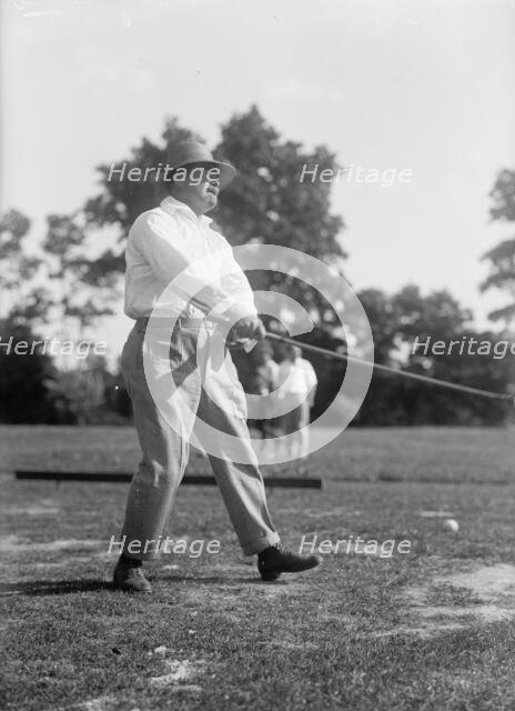 Reynolds, Ziba W. Pay Inspector of The Navy - Playing Golf, 1916. Creator: Harris & Ewing.