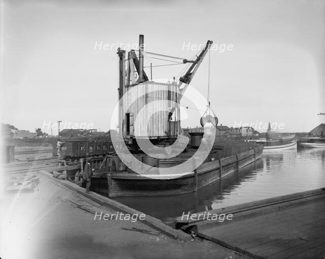 Fueling lighter with clam shell hoist, Ashtabula, Ohio, ca 1900. Creator: Unknown.