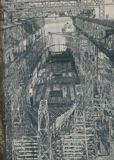 'A Nest of Steel. Cunard White Star liner Georgic in construction, 1927-1929, (1936). Artist: Unknown.