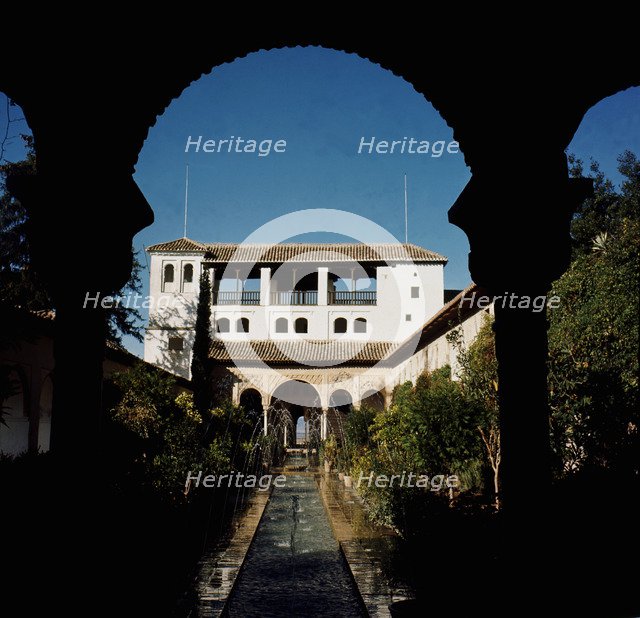 View of the courtyard of the ditch with the gardens and fountains of the Alhambra, at the bottom …