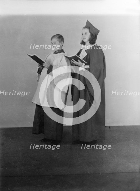 Girl and boy chorister, (Isle of Wight?), c1935. Creator: Kirk & Sons of Cowes.