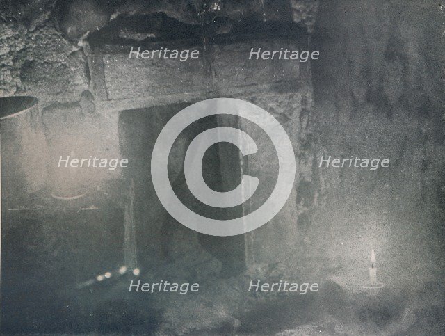 'Inside Door of Igloo by Light of Blubber Lamps', c1911, (1913). Artist: G Murray Levick.