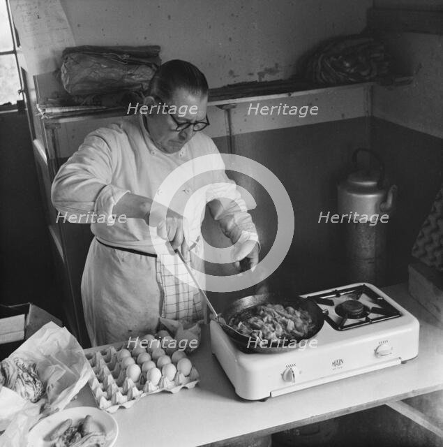 Preparing food for staff working on the construction site of the M1, 09/1958. Creator: John Laing plc.