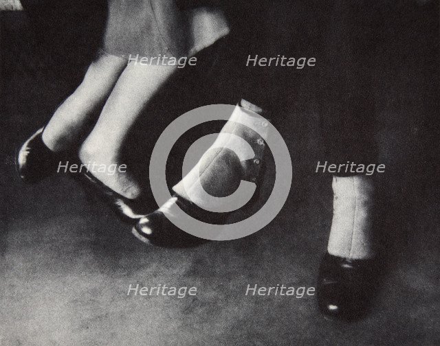 Feet of passengers on the New York subway, USA, early 1930s. Artist: Unknown