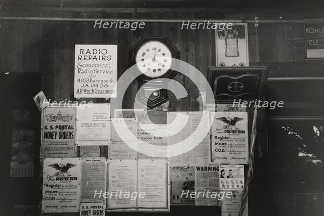 Posters and decorations in combined general store and post office, Olga, Louisiana,  1938-09. Creator: Russell Lee.