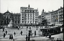 Electric Tram with trailer load circulating through the Plaza of the Constitution of Zaragoza (Ar…
