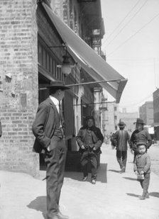 Street scene in Chinatown, San Francisco, between 1896 and 1930. Creator: Arnold Genthe.