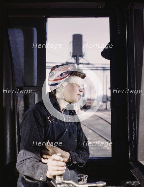 C. & N.W. R.R. Cloe Weaver, mother of four children, employed...the roundhouse, Clinton, Iowa, 1943. Creator: Jack Delano.