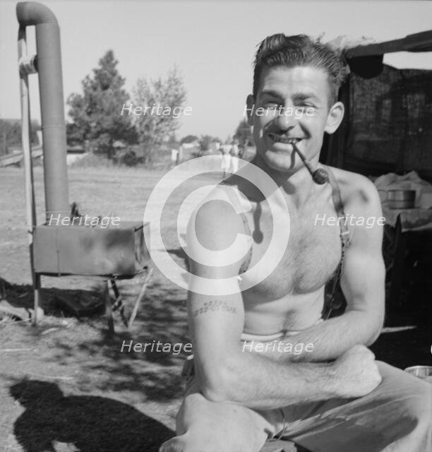 Unemployed lumber worker goes with his wife to the bean harvest, Oregon, 1939. Creator: Dorothea Lange.