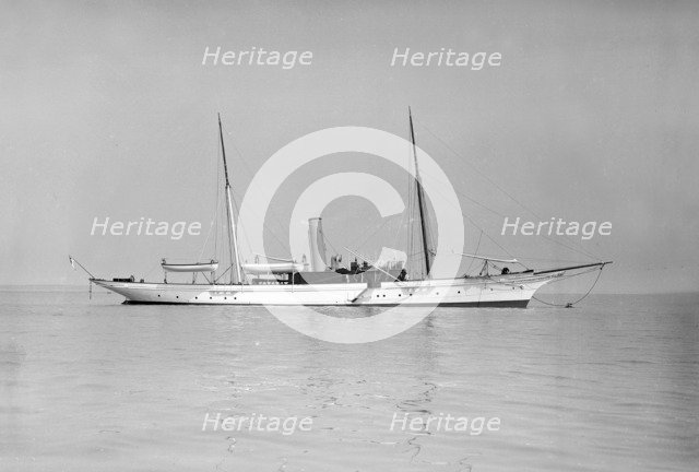 The 70 ton steam yacht 'Ombra' at anchor, 1911. Creator: Kirk & Sons of Cowes.