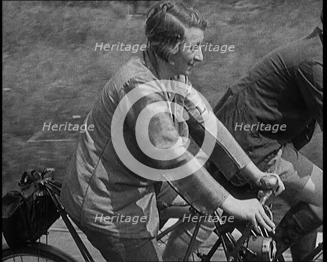 Large Group of Civilians Riding Bicycles Through Country Lanes, 1931. Creator: British Pathe Ltd.