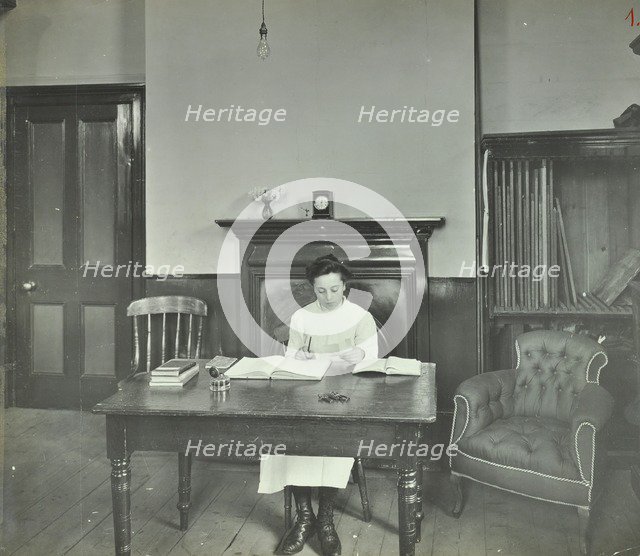 Female student sitting at desk, Shoreditch Technical Institute, London, 1907. Artist: Unknown.