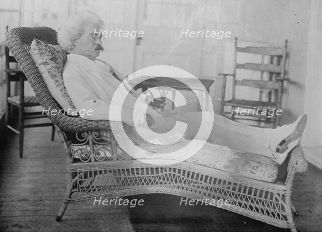 S.L. Clemens reclining in porch chair, 1910. Creator: Bain News Service.