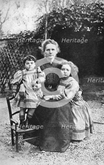 Marie Curie, Polish-born French physicist, with her daughters Eve and Irene, 1908. Artist: Unknown